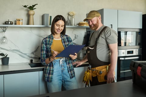 Professional reviewing project details with homeowner